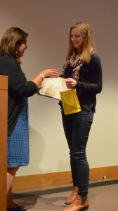 A Middle East Studies certificate student receiving his certificate from faculty director Nevine El Nossery