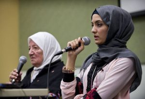 Two People Speaking at an Event