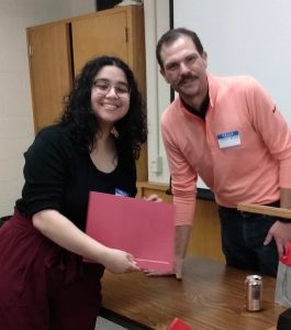 A Middle East Studies Certificate Student receiving her certificate from faculty director Steven Brooke